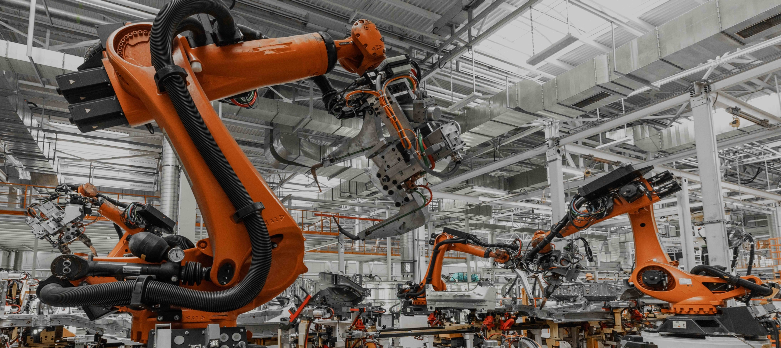 Photo of automobile production line. Welding car body. Modern car assembly plant. Auto industry 機械手臂潤滑油